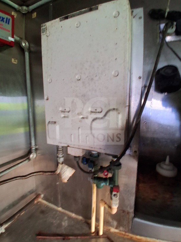 2019 Quality Cargo food trailer interior with visible piping and equipment. Suitable for commercial kitchen use.
