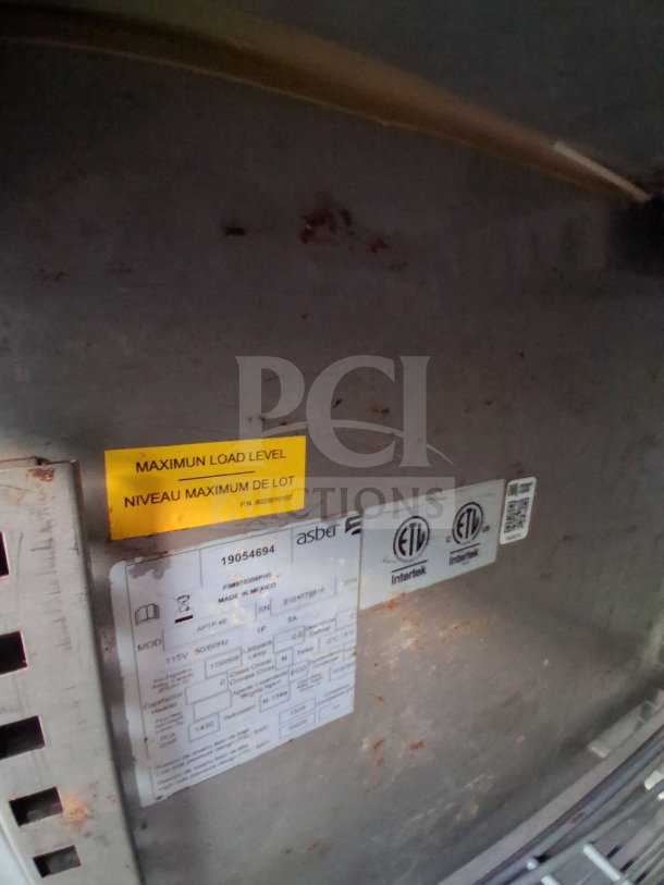 2019 Quality Cargo food trailer label showing serial number, load level, and certifications. Features commercial kitchen equipment.