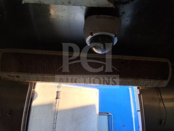 2019 Quality Cargo Food Trailer with commercial kitchen setup, including grease hood and security camera.