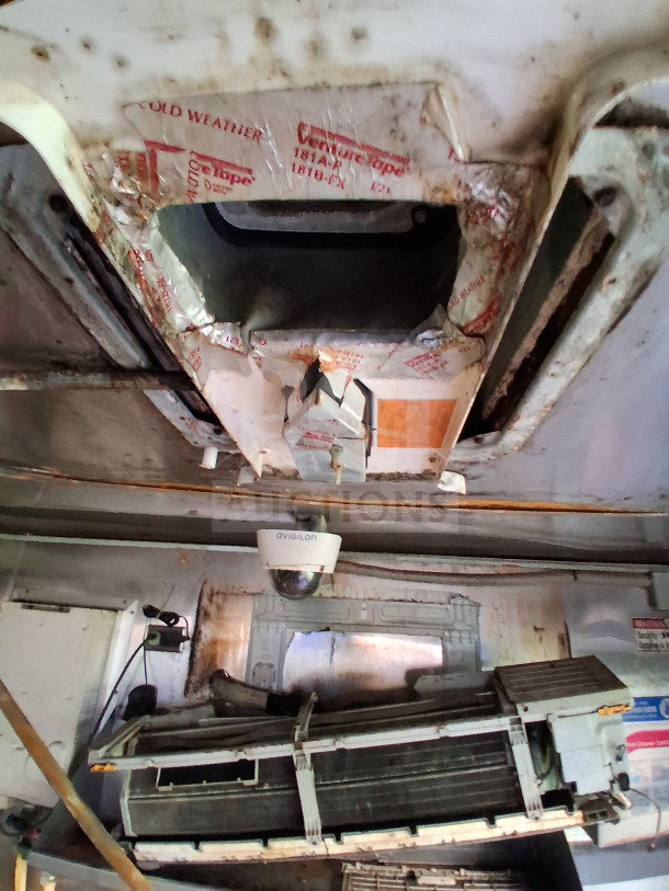 2019 Quality Cargo food trailer interior, showing ventilation and camera system. Signs of wear; equipped with kitchen essentials.