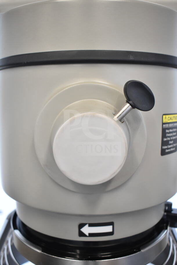 BRAND NEW 2025 Globe SP40 40 Qt. Mixer, scratch and dent, with manual bowl lift, attachments, and caution label visible.