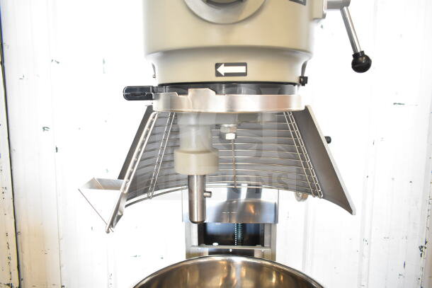 Brand new Globe SP40 mixer, 40 qt, manual bowl lift, scratch and dent condition, with bowl guard, dough hook, and whisk.