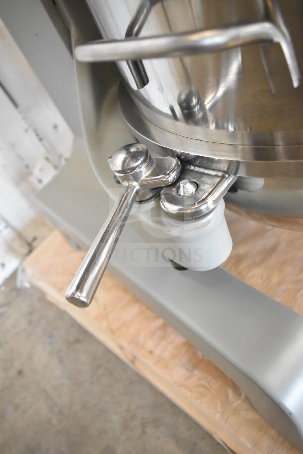 Brand new Globe SP40 mixer showing manual bowl lift, stainless steel construction. Includes bowl, bowl guard, attachments.