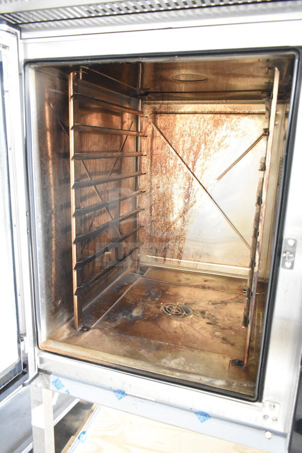 Brand new Blodgett Invoq Hybrid 10-2/1GN convection oven interior, showing scratch and dent condition. Ventless Hoodini included.