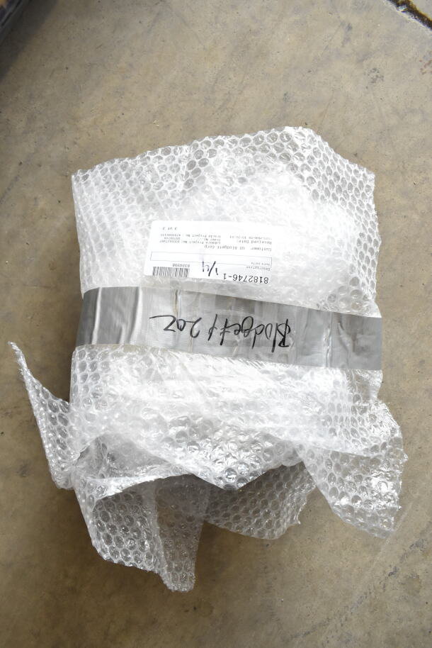 Bubble-wrapped package with visible label for Blodgett Hoodini 10-2/1GN, indicating a new 2024 electric combi oven.