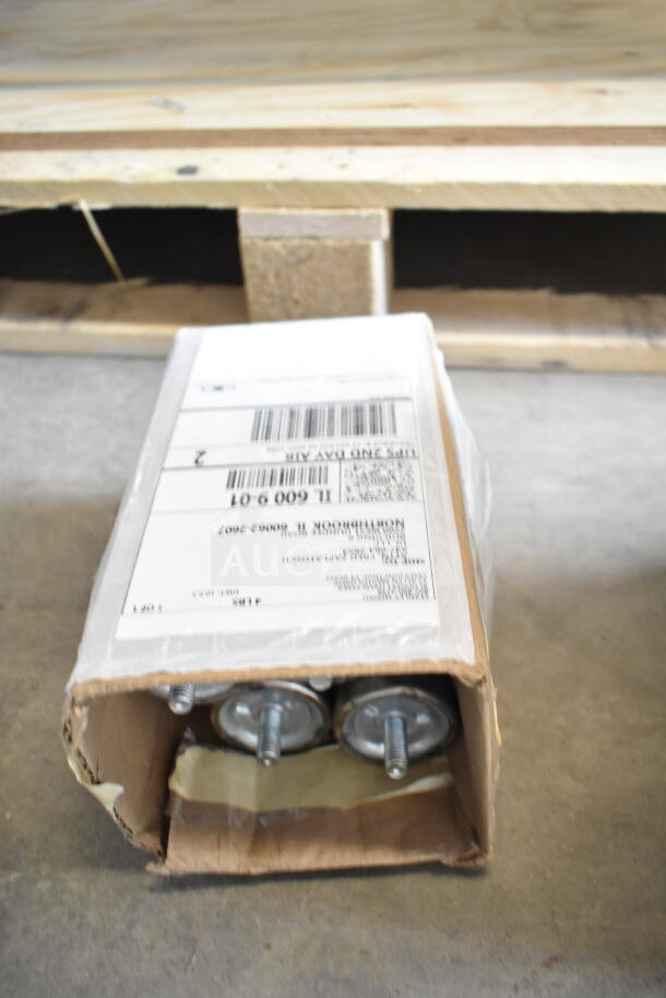 Cardboard box with shipping label showing metal parts inside, part of a Blodgett Invoq Hybrid oven package.