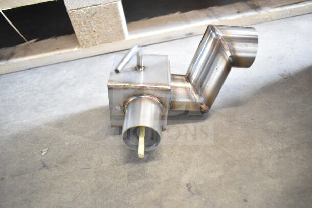 Stainless steel duct piece from a 2024 Blodgett Invoq Hybrid oven, showcasing detailed welds and cylindrical openings.