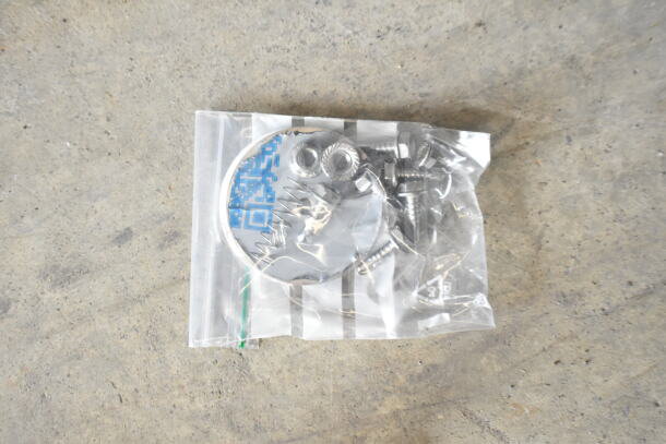 Plastic bag with assorted screws and metal pieces, one with a blue QR code sticker visible.
