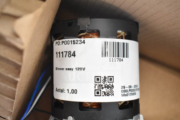 Blower assembly with label showing part number 111784, 120V specification, and barcode.