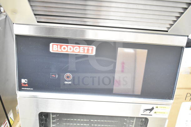 Brand new Blodgett BLCT-10E-H commercial combi oven with ventless hood, 208V, 3 phase, minor scratches, model label visible.