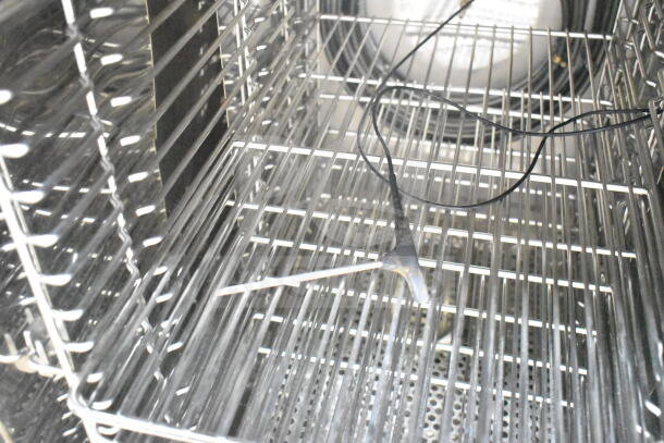 BRAND NEW Blodgett BLCT-10E-H combi convection oven interior. Stainless steel racks visible, includes ventless hood.