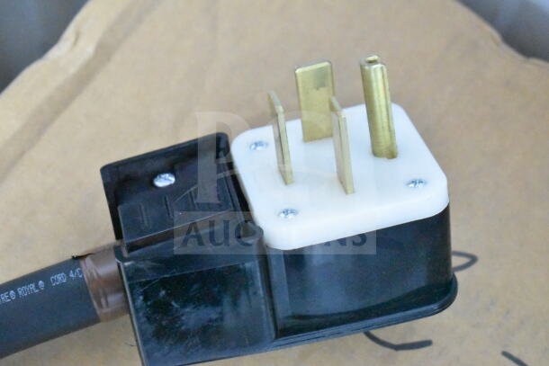 Power plug for Blodgett BLCT-10E-H combi oven, 208V, 3-phase, with visible prongs on cardboard surface.