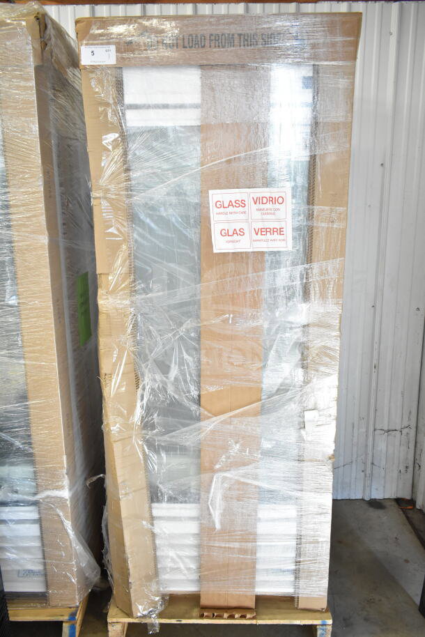 Brand new True TSCI-600R-G-PH reach-in cooler, single door, 115 volts, in packaging, glass stickers visible.