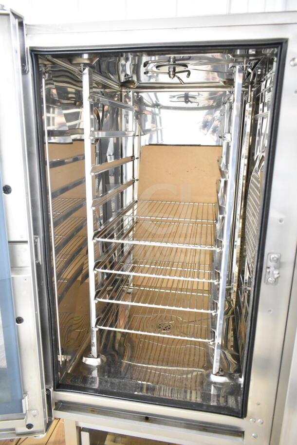 Brand new 2019 Blodgett BLCT-101/CPE 1.10 combi convection oven, 208V, 3 phase. Interior view showing clean racks.
