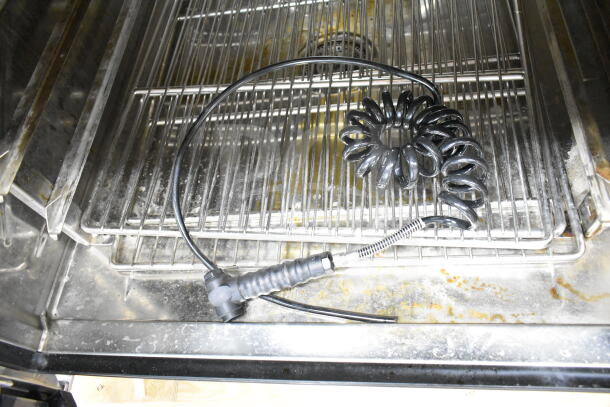 Brand new 2023 Blodgett Invoq: Hybrid 6-2/1GN combi convection oven interior, featuring racks and coiled cable.