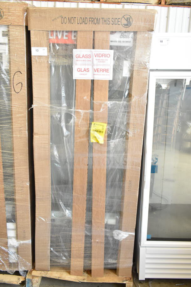 BRAND NEW True GDM-26-HC cooler, 2026 model, wrapped, with labels for glass handling. 115 Volts, 1 Phase. Scratch and dent condition.