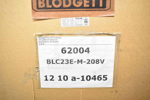 Brand new Blodgett BLCM23E/CSC2306 combi convection oven, scratch and dent, 208/230/240-400/415V. Box label shows model and specs.