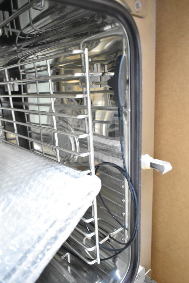 Brand new Blodgett BLCM23E/CSC2306 electric combi convection oven, intact packaging, 208/230/240-400/415 volts, stainless steel interior.