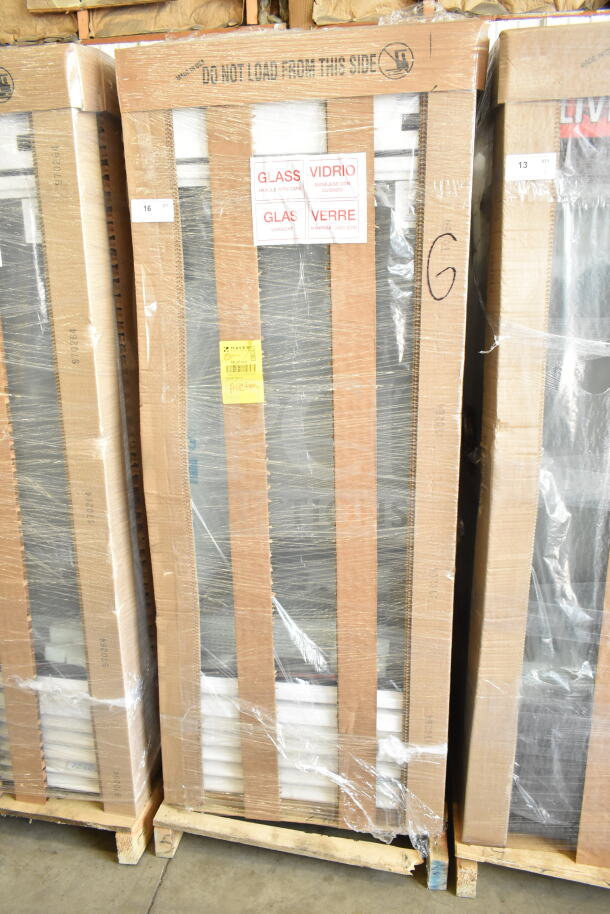 Alt text: "New True TSCI-600R-G-PH cooler in packaging with 'Glass' warning labels. Single door, 115V, scratch and dent."
