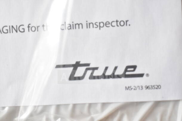 Alt text: True brand label on a document, part of the 2026 TSCI-600R-G-PH commercial single door reach-in cooler merchandiser.