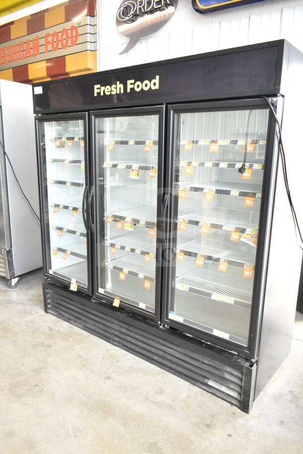 2020 True GDM-72-HC commercial 3-door reach-in cooler merchandiser, featuring glass doors, "Fresh Food" signage, and interior shelves.