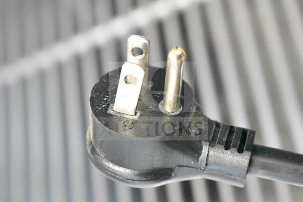 Close-up of a 115V power plug for the 2019 True T-23F-HC commercial freezer. Black cord in good condition.