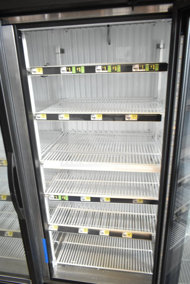 2020 True GDM-72F-HC commercial 3-door reach-in freezer merchandiser with glass doors, white interior, 5 wire shelves.