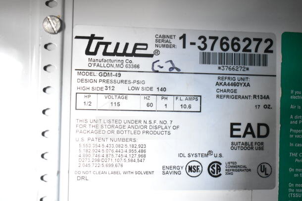 True GDM-49 2-door reach-in cooler label, model GDM-49. Voltage 115, phase 1, refrigerant R134A, NSF certified.