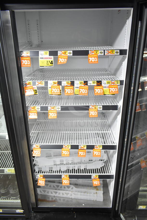 2020 True GDM-72-HC Commercial 3 Door Reach In Cooler, white interior, multiple shelves, clearance tags visible.