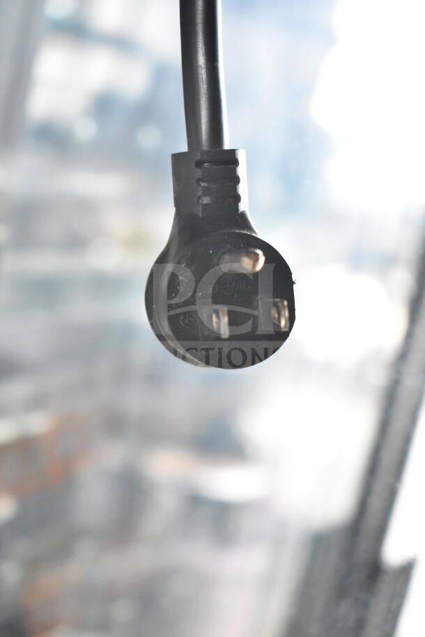 2020 True GDM-72-HC commercial three-door cooler plug detail, 115 volts, 1 phase, black plug, Ching Cheng marking.