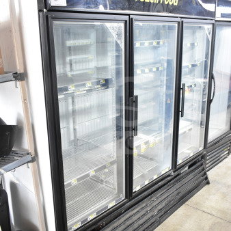 True GDM-72F-LD Commercial 3 Door Freezer Merchandiser, black trim, glass doors, "Frozen Food" signage, used condition.