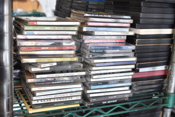 340 various DVDs including "8 Mile," "Catch Me if You Can," "The Simpsons," "Bad Teacher," "A-Team," and "Paranormal Activity."