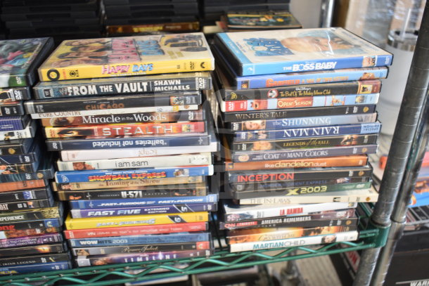 Collection of 340 DVDs, including "8 Mile," "The Simpsons," and "A Team." Mixed titles. Good condition.