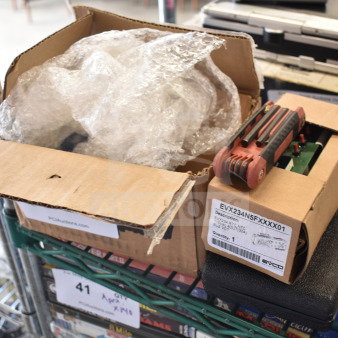 Four items including Fryclone Oil Pump 259POFM728L, EVX234N5FXXXX01 panel, and tool in a hard case. Boxes on shelf.