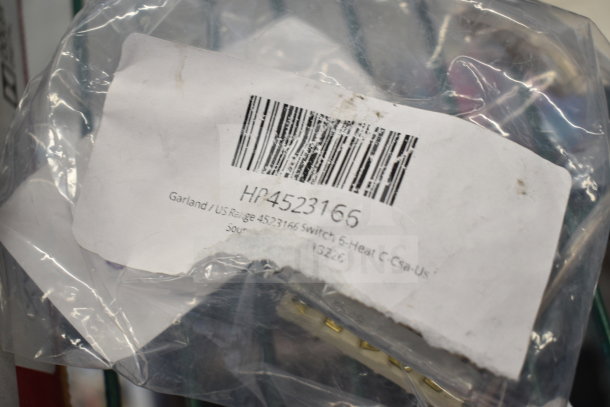 A Garland/US Range 4523166 Switch 5-Heat C-Csau-Us in plastic packaging with a visible barcode and product label.