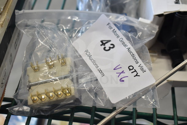 Alt text: Six-pack of assorted industrial components, including Garland thermostat assembly. Bag labeled "QTY VX6."