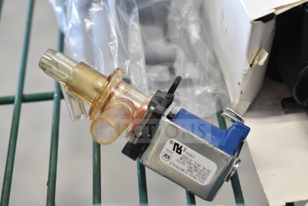 Various items including a Manitowoc 000014062 Water Dump Valve, featuring a 115V/60 HZ design, new condition.