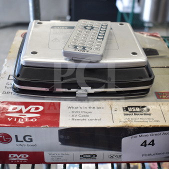 Two DVD players, including an LG with original box, and a Coby with remote, both in used condition.