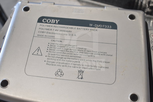 Coby DVD Player polymer rechargeable battery pack, model TF-DVD7333, 7.4V 3500mAh, visible caution and recycling labels.