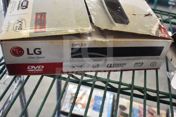 LG DP132 DVD player in original packaging with visible wear. Features Xvid Home, Dolby Digital, MP3 CD-R/RW playback.