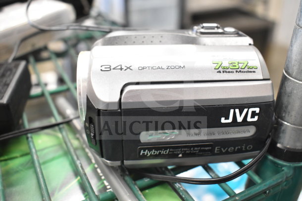 JVC Everio camcorder with 34x optical zoom, hybrid HDD/SD recording, 7-37 hr modes; part of a 5-item auction lot.