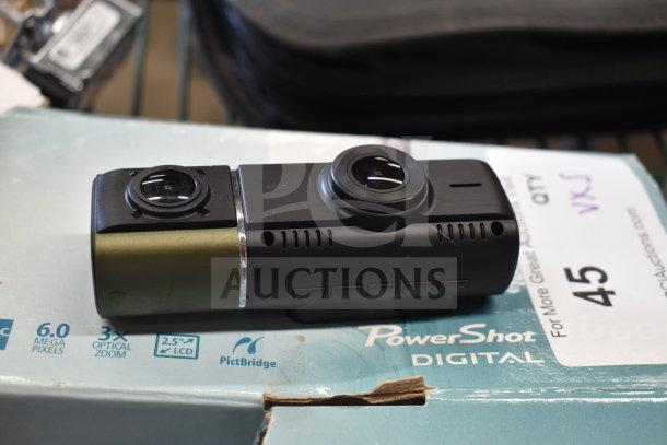 Canon PowerShot Digital Camera on packaging, featuring 6.0 megapixels and 3x optical zoom. Condition appears used.