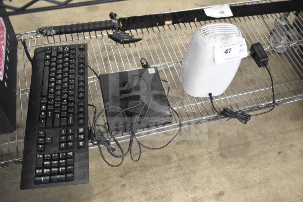 Three items: Lenovo keyboard, ProBreeze dehumidifier with power cord, and Lenovo ThinkCentre desktop. Auction lot marked "47".