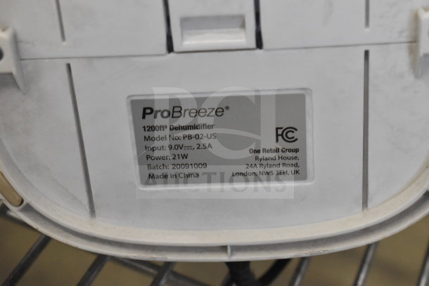ProBreeze 1200ft³ Dehumidifier, model PB-02-US, 9.0V, 2.5A, 21W, Made in China, FCC certified label visible.