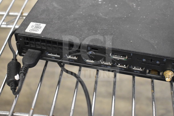 Lenovo ThinkCentre rear ports with visible Intel Core i5 Pro label, showing USB, HDMI, and Ethernet connections.