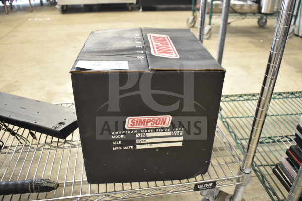 Simpson VN Helmet box, size 6-7/8, with model and manufacture date labeled. Black packaging with red logo.