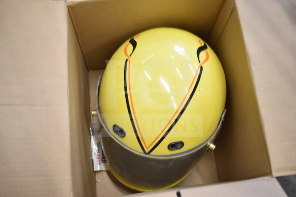 Simpson VN 6-7/8 Helmet, yellow with black and orange design, in good condition, shown in a cardboard box.