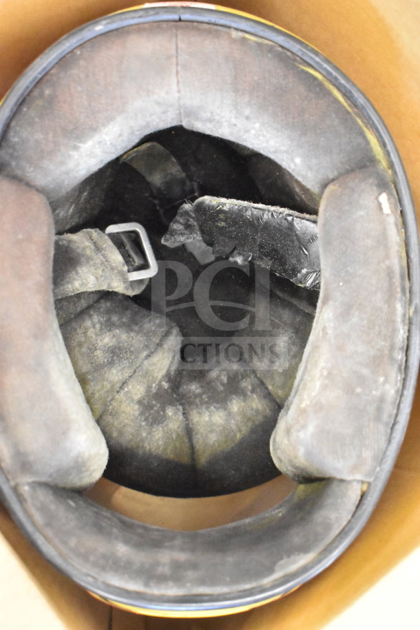 Simpson VN 6-7/8 helmet interior view, showing wear on padding and strap. Helmet appears used; padding slightly discolored.