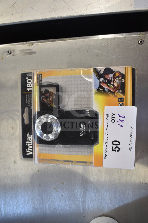 Vivitar DVR 426HD digital camcorder in original packaging, features 180° screen rotation, new condition, auction lot 8x.