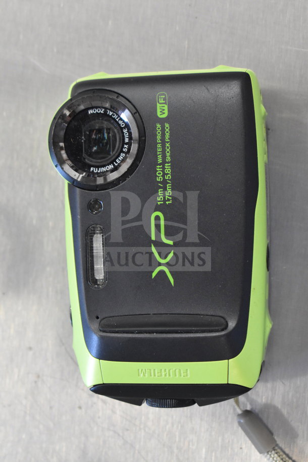 Fujifilm XP waterproof camera, green and black, 15m/50ft waterproof, shockproof. WiFi enabled. Moderate wear.